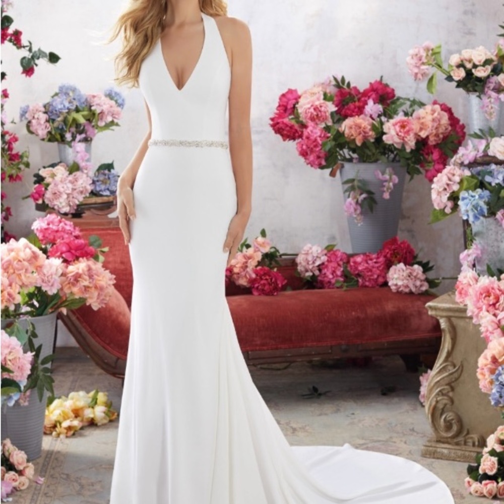 Wedding dress. Never worn, never altered, tags still attached.